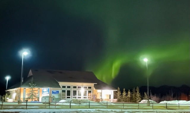 Northern Lights above VCA Far Country Animal Hospital at night