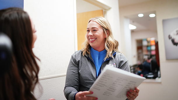 Veterinary staff talking with colleague