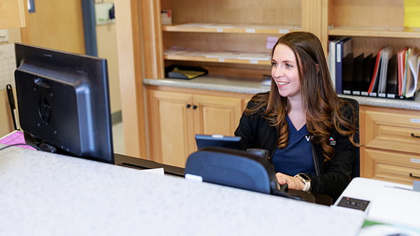 A woman sitting at a desk