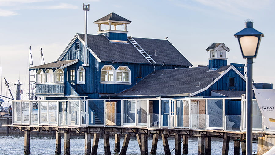 Blue house on the dock by the water