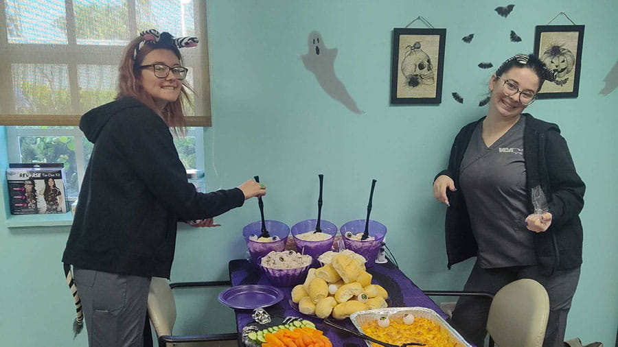 VCA Miracle Mile Animal Hospital staff members at a Halloween Potluck