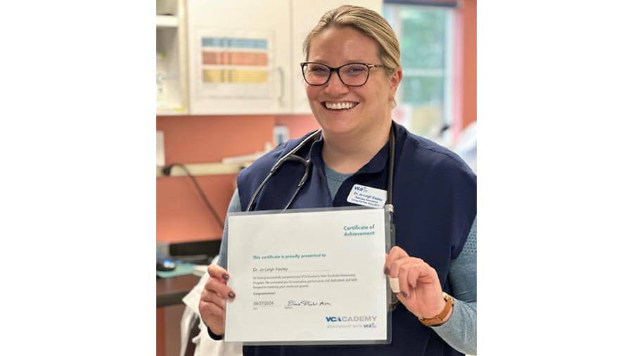 Dr. Keeley holding a certificate