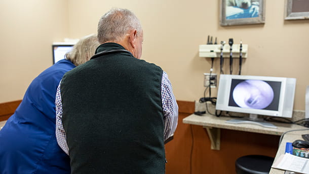 Veterinary staff reviewing an otoscopy at VCA Cairo Animal Hospital