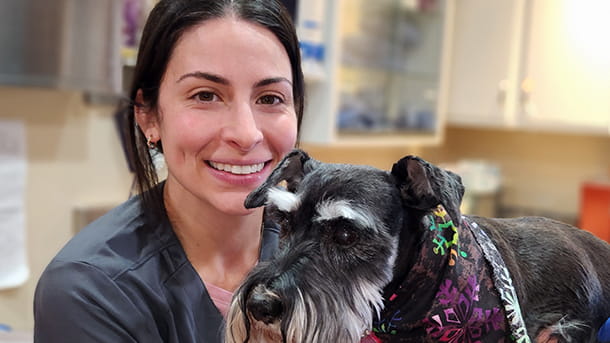 Veterinary assistant with senior dog